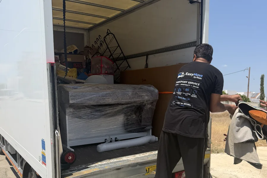 EasyMove by Klein crew loading furniture into a Luton van in Cyprus